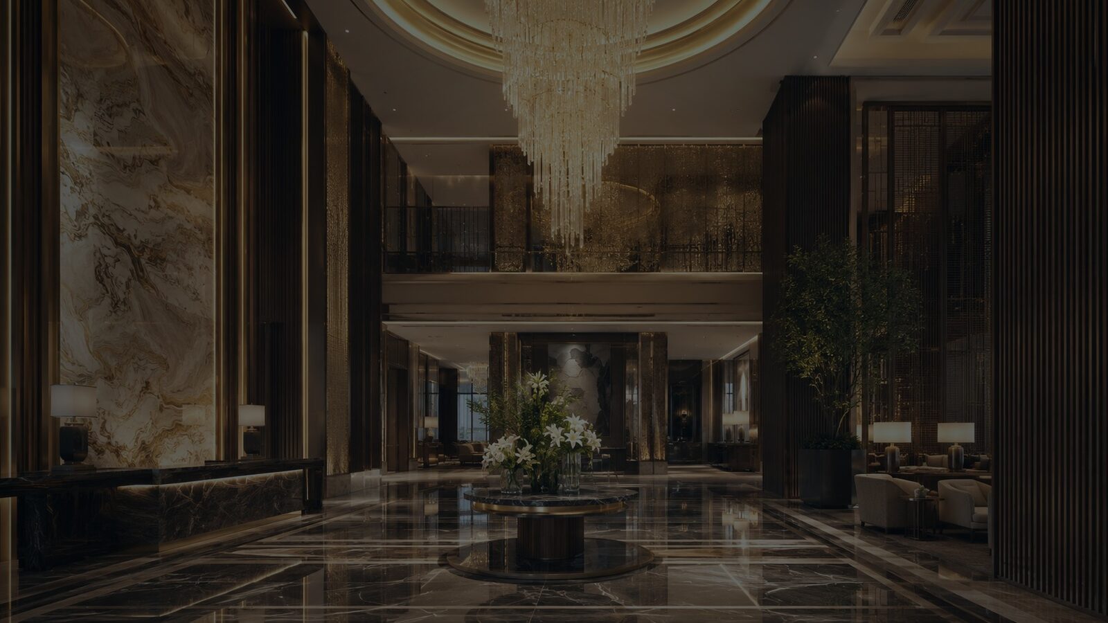Grand luxury hotel lobby with chandelier and marble finishes